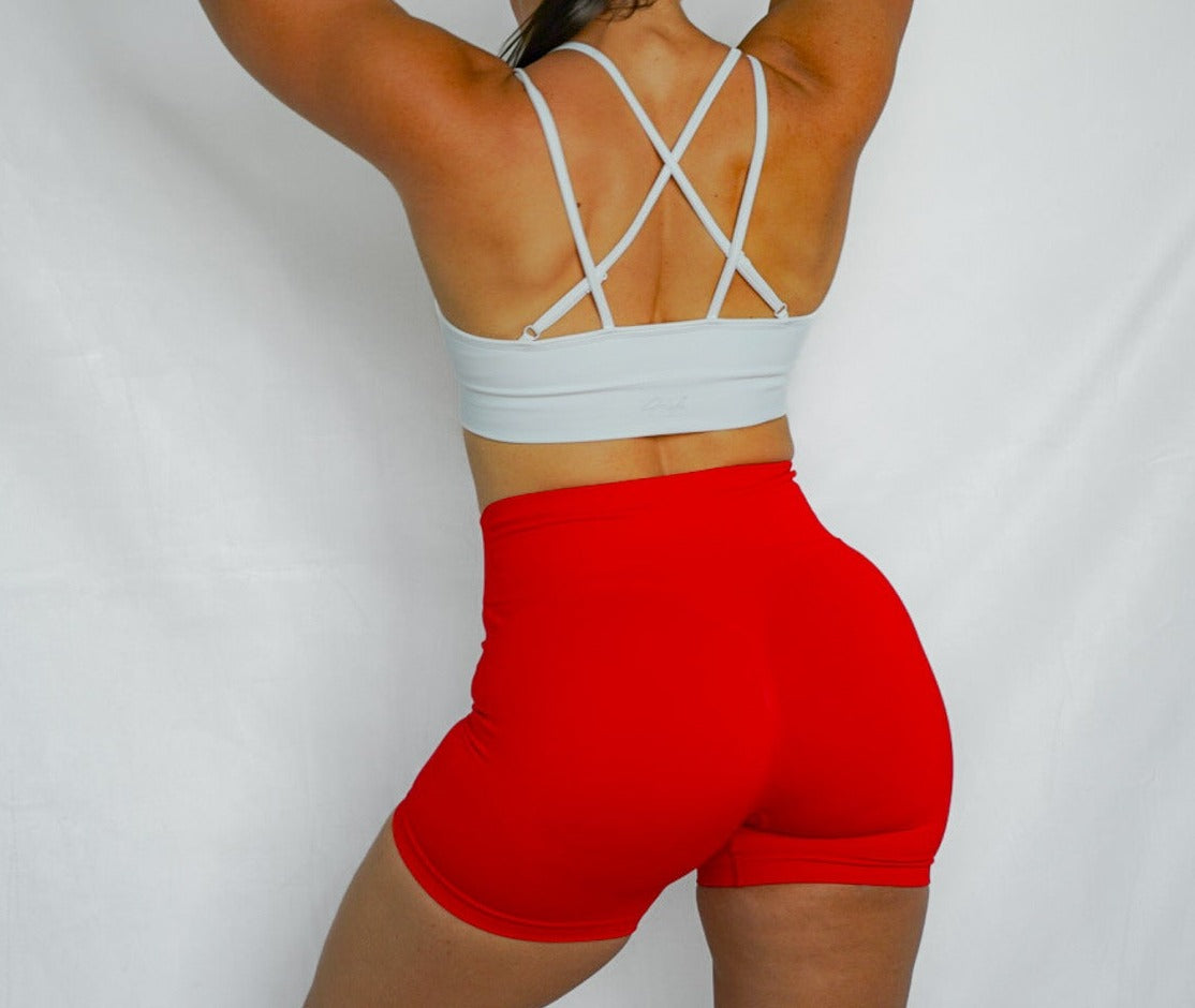 strappy back seamless sports bra with removable cup pads, ultra soft and comfortable back view in white